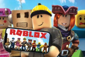 Roblox game app on the smartphone screen with the game blurred in the background. Top view. Rio de Janeiro, RJ, Brazil. June 2021.